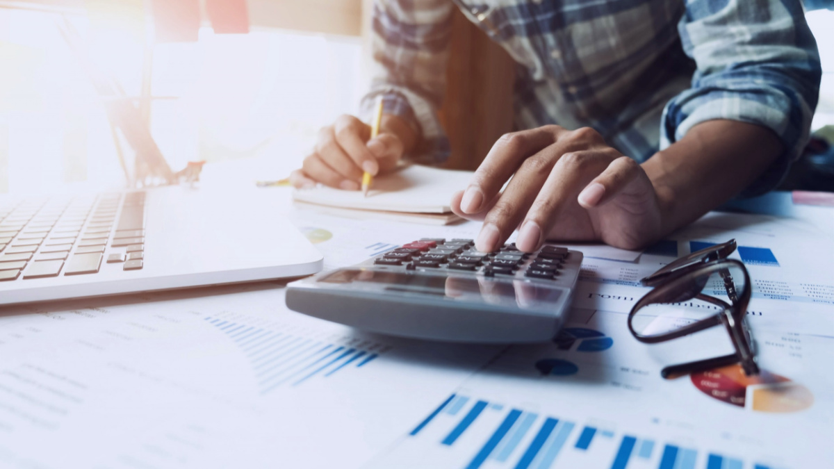 man working with calculator